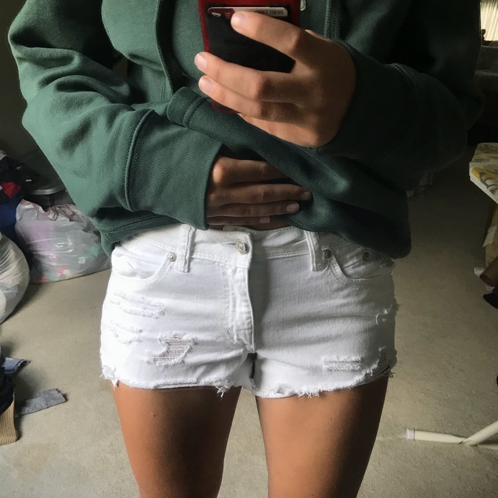 White ripped jean shorts